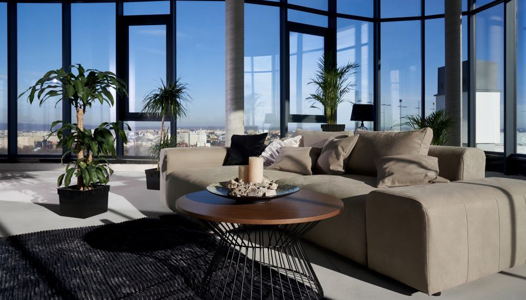 Modern spacious room with large panoramic window.